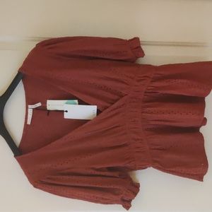 Beautiful, flattering, never worn blouse. LUQ brand, with tags.